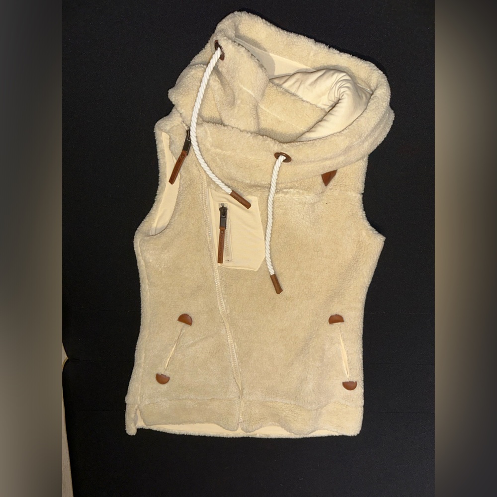 Size small Tan Wanakome Vest. Great for a winter vest!